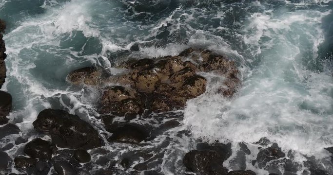 Wave crash into rock coastline, Atlantic Ocean, Porto Moniz, Madeira Island Portugal, Slow Motion 4K