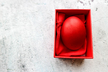 red easter egg in a red gift box wallpaper