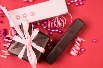 Gift boxes with bow on red background