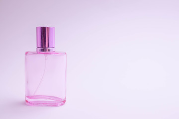 Glass bottle of perfume on white background. Pink, blue, green, black bottle. Women's and men's perfume. Aromatherapy, spa.