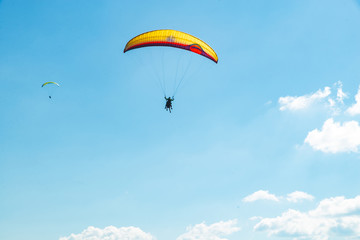 mountains leisure activities. paragliding. summer time