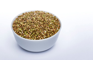 Green buckwheat seeds isolated on white background