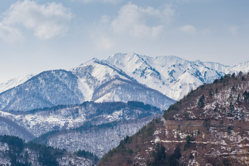 mountains landscape with snow and wood cabin winter travel