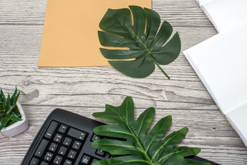 Flat lay, top view office table desk. Workspace with blank clip board, keyboard, office supplies,...