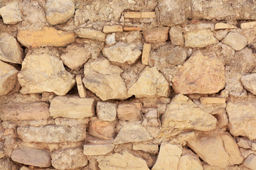 stone background. yellow masonry