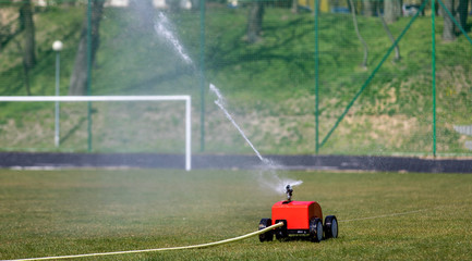  Automatic lawn watering. Sprayer of grass. automatic sprinkler system watering the lawn