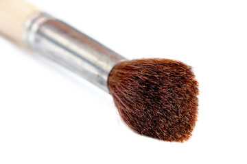 Wooden painting brush isolated. Selective focus