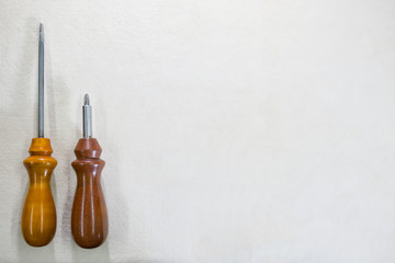 screwdriver with wooden handle on white background, copy space