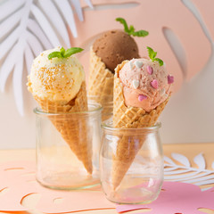 Waffle cones with strawberry, vanilla, chocolate ice cream