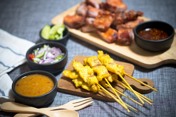 Pork satay grilled pork served with sweet peanut dipping sauce and vinegar.