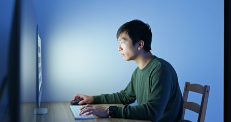 Man work on computer at home