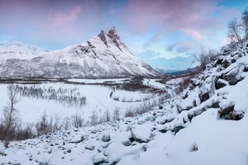 Beautiful landscape scene with Signaldalelva river and Otertinden mountain in background in...
