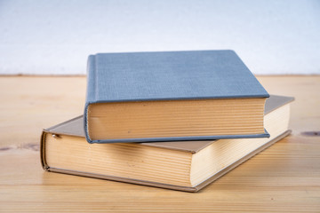 Two books on the wooden table, education
