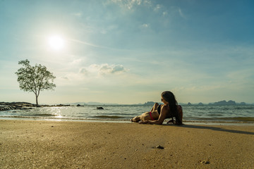 woman on the beach at sunset