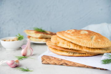 Homemade chebureks with potatoes. Of diet food. Pies with potatoes and mushrooms.