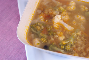 Soup with red lentils, broccoli, cauliflower on the table. Top view