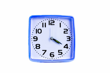 blue plastic reto alarm clock with white face time at 4:20, isolated on white