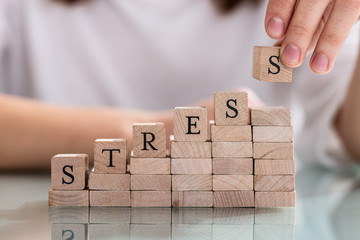 Person's Hand Placing Last Alphabet Of Word Stress