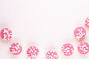 Colorful cupcakes on a white background.