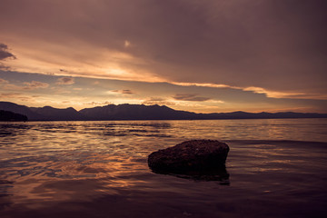 Fototapeta na wymiar Dramatic Sky and Rock Reflection at Lake Tahoe in United States of America