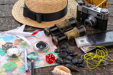 items and accessories for the traveler on the old background on the table