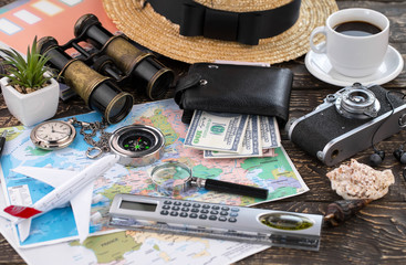 items and accessories for the traveler on the old background on the table