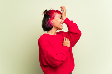 Young woman with red sweater has just realized something and has intending the solution