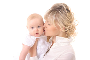 cheerful beautiful young woman holding baby in hands