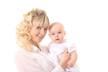 cheerful beautiful young woman holding baby in hands