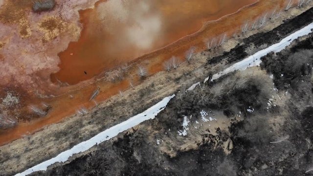 Septic lakeDrone flight of red mud lake nearby old aluminum factory.