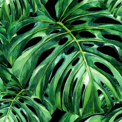 Obraz na płótnie Canvas Watercolor seamless pattern of tropical leaves.