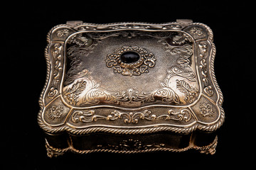 Silver vintage square jewelry box in black background