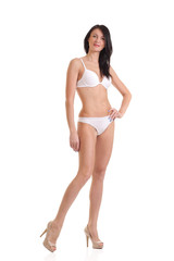 Fototapeta premium woman with a slim figure in white lingerie