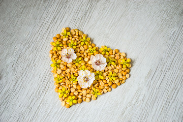 Fototapeta na wymiar heart of peas and flowers