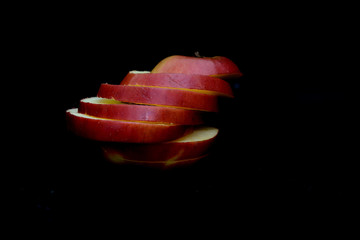 Sliced Apple   on a black background. Concept - apple diet
