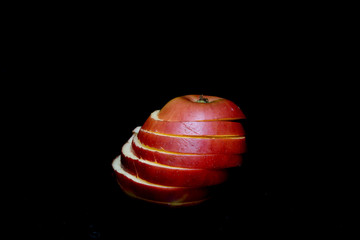 Sliced Apple &nbsp; on a black background. Concept - apple diet