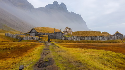 An abandoned vikings village. Sod rooftops, turf rooftops. Village located at the bottom of a high...
