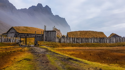 An abandoned vikings village. Sod rooftops, turf rooftops. Village located at the bottom of a high...