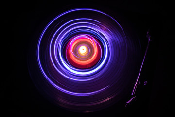 Concept of speed - Trail of fire and smoke - Vinyl record. Burning vinyl disk. Turntable vinyl record player. Retro audio equipment for disc jockey. Sound technology
