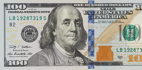 The denomination hundred dollars on isolated white background - obrazy, fototapety, plakaty