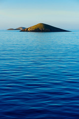 Islet in Deep Blue Water