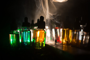 Silhouette of a man standing in the middle of the road on a misty night with giant glass bottles...