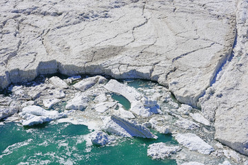 View of frozen ice chunks breaking and melting into the Niagara River in the spring