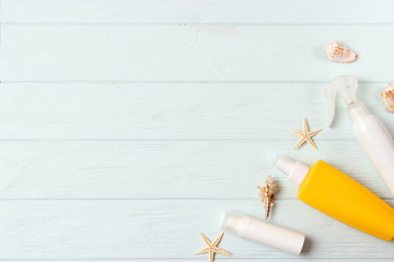  seashells and sunscreen on a colored background top view. Sunscreen