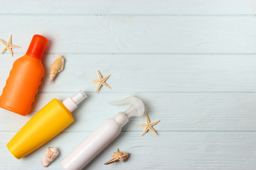  seashells and sunscreen on a colored background top view. Sunscreen