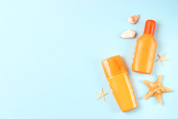  seashells and sunscreen on a colored background top view. Sunscreen