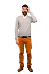 Fototapeta premium Handsome man has just realized something and has intending the solution over isolated white background