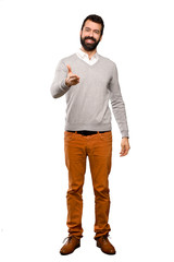 Fototapeta premium Handsome man shaking hands for closing a good deal over isolated white background