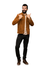 Fototapeta premium Handsome man with beard with thumbs up gesture and smiling over isolated white background