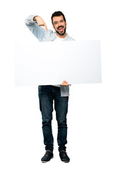 Handsome man with beard  holding an empty placard